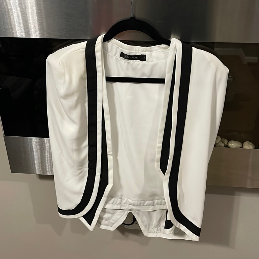 Cape Town time black and white sleeveless blazer.